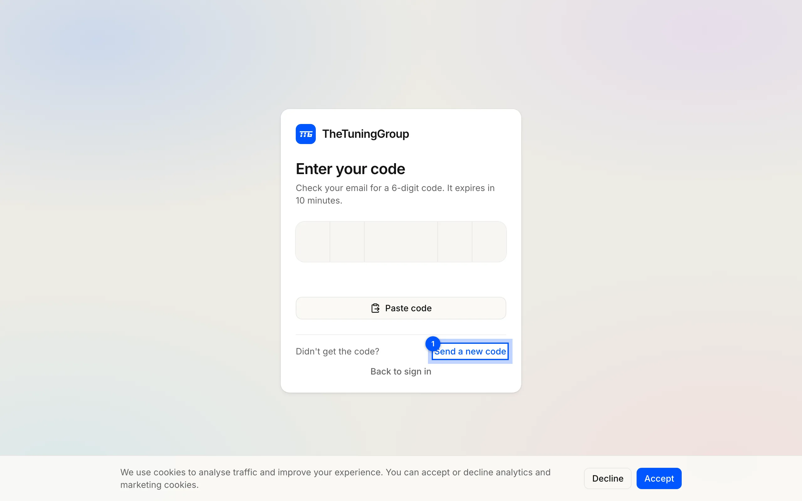The one-time code screen: six code boxes, a Paste code button, and the Send a new code link that replaces the code you already have.