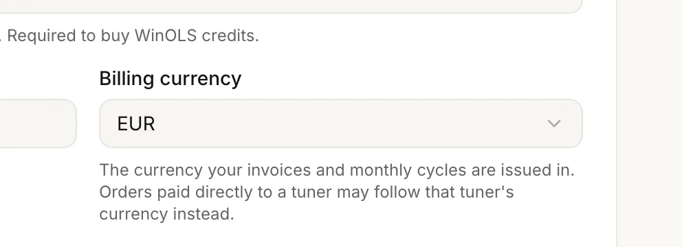 The billing-currency picker in account settings, with the note that it drives invoices and monthly cycles.