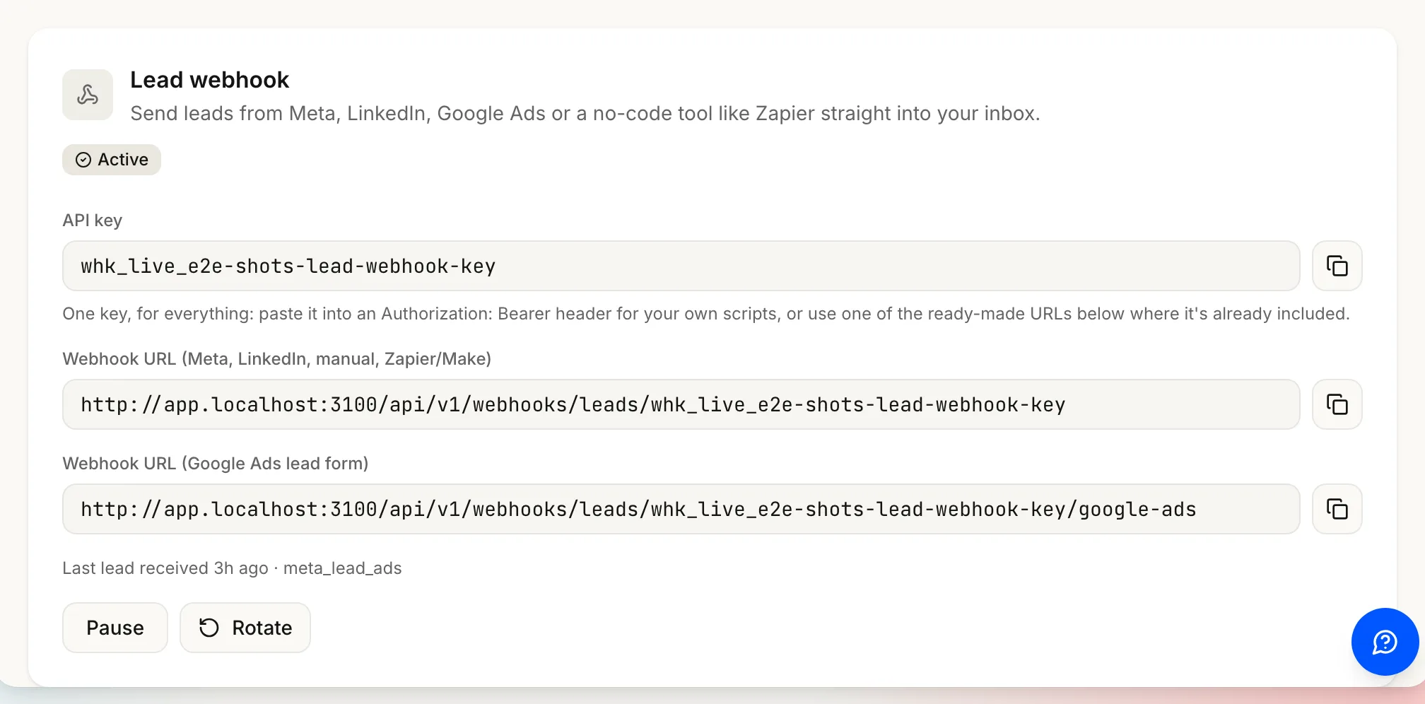 The Ad leads card, activated and Active, showing the API key field and both webhook URLs, with Pause and Rotate.